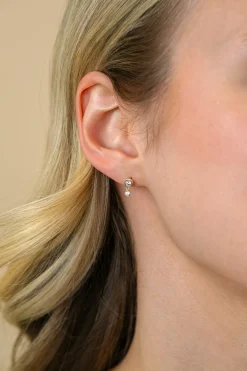 Discount Zinzi 9mm Gold 14 krt gouden ronde oorstekers met bungelend een kleinere witte zirconia ZGO371