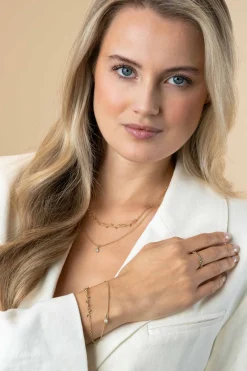 Clearance Zinzi gold plated zilveren aanschuifring met bolletjes scheen en drie ronde zettingen bezet met witte zirconia ZIR2569