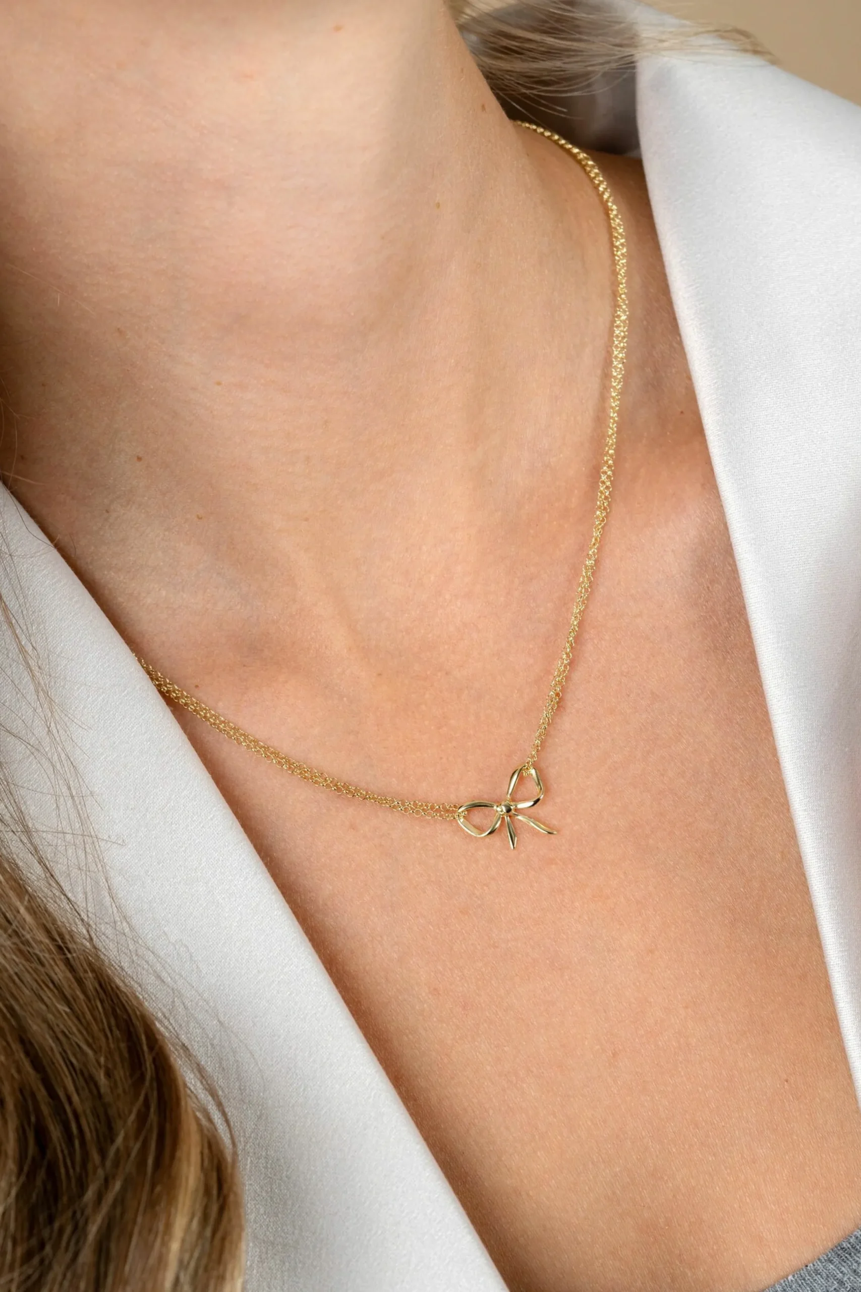 Outlet Zinzi gold plated zilveren multi-look ketting met sierlijke strik 40-43cm ZIC2677