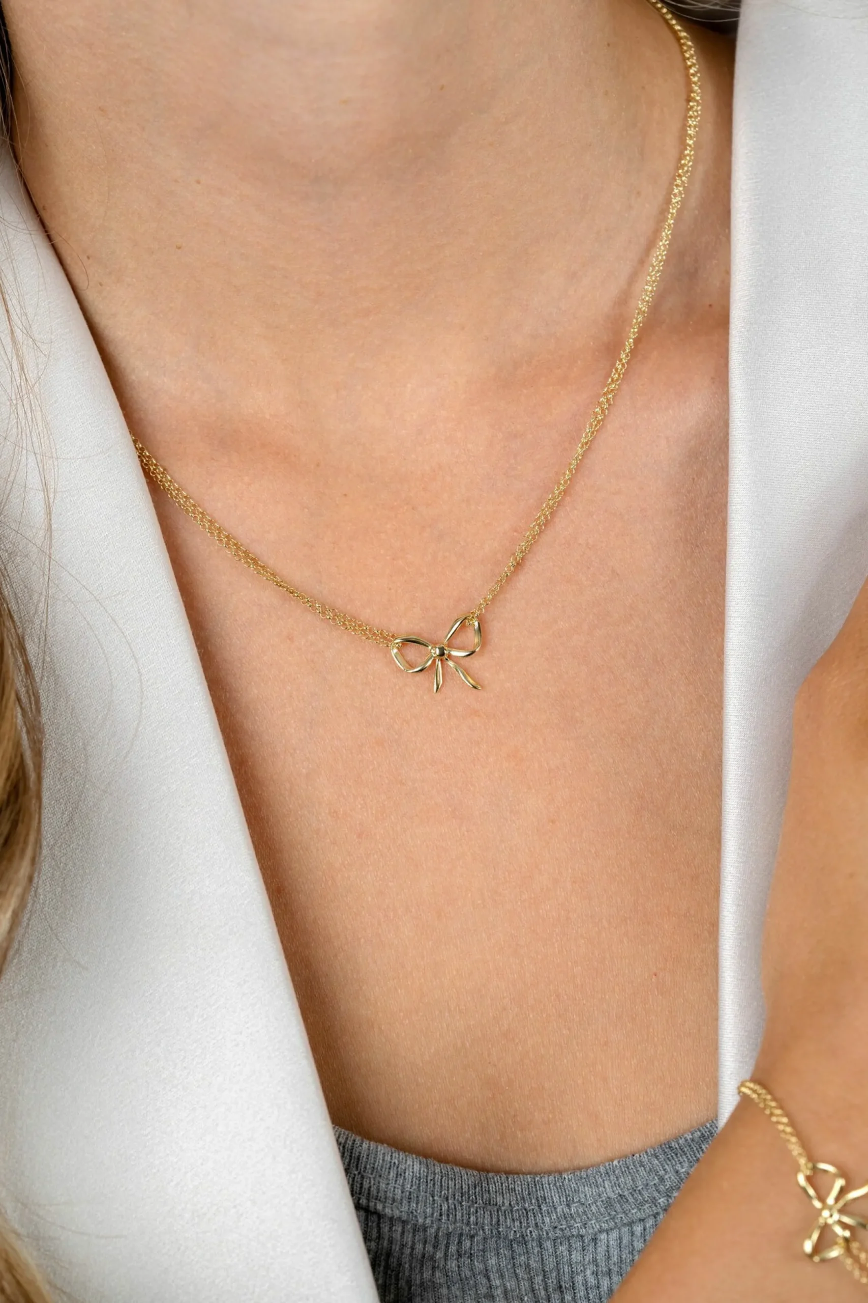 Outlet Zinzi gold plated zilveren multi-look ketting met sierlijke strik 40-43cm ZIC2677
