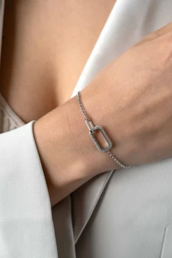 Clearance Zinzi zilveren armband met twee verbonden schakels: een rechthoekige bezet met witte zirconia's en een gladde ovale schakel 16,5-19,5cm ZIA2551
