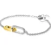 Clearance Zinzi zilveren schakelarmband met twee verbonden ovale schakels: ene gold plated, ander bezet met witte zirkonia's ZIA2758