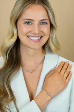 Clearance Zinzi zilveren schakelarmband met twee verbonden ovale schakels: ene gold plated, ander bezet met witte zirkonia's ZIA2758
