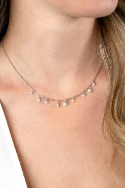 Outlet Zinzi zilveren schakelketting met negen ronde witte glasparels in verschillende groottes, speels verdeeld over de ketting 40-45cm ZIC2623